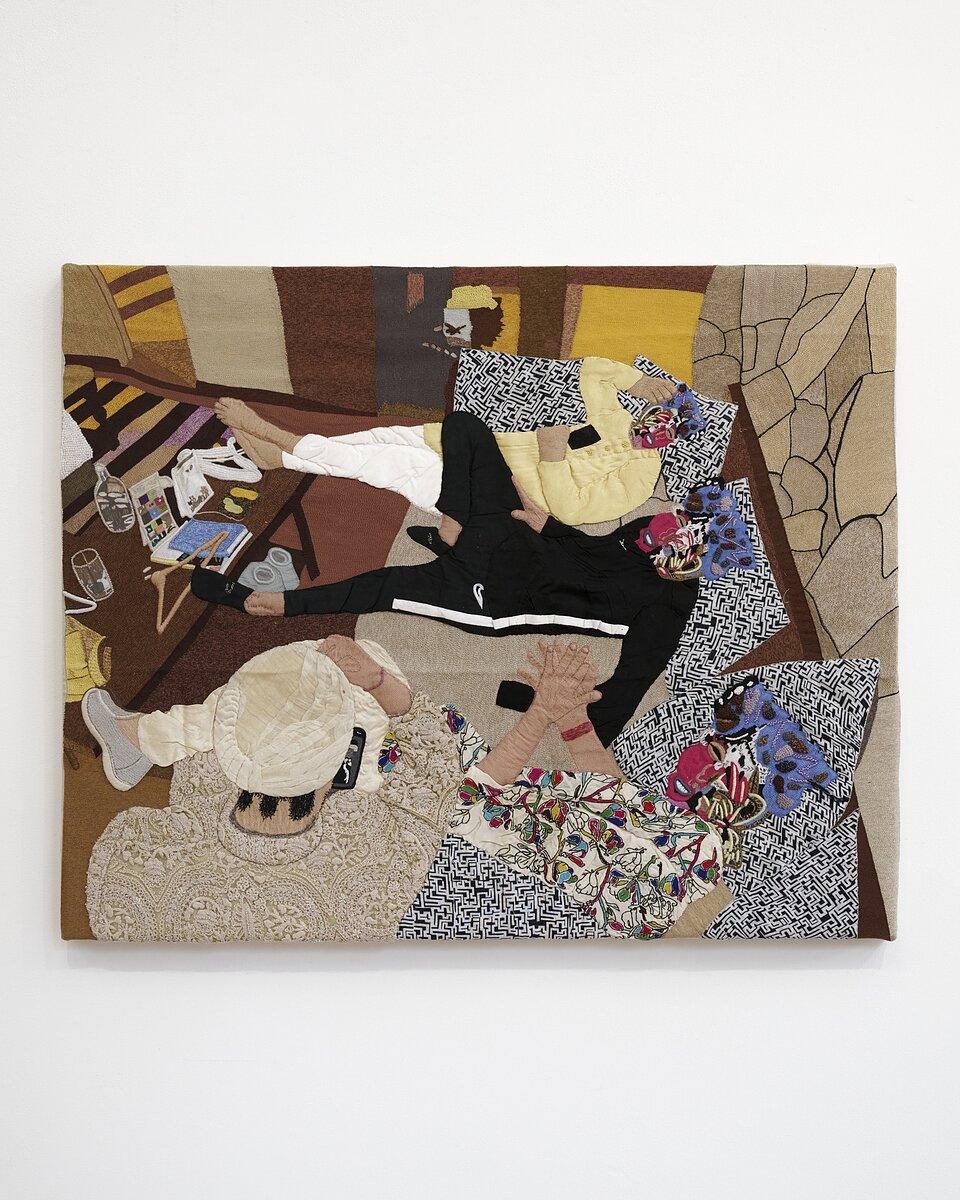 A textile work on canvas featuring four figures reclined on a couch, rendered in stitched-together textiles.