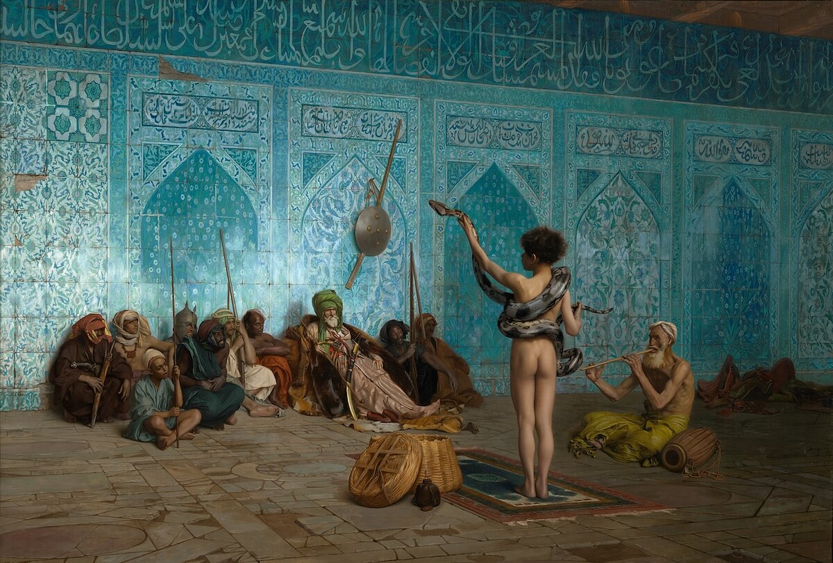 A painting of a nude boy with a snake coiled around his body performing for a group of reclined men in an ornate, blue-tiled room.